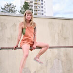 woman doing gymnastics on a pole